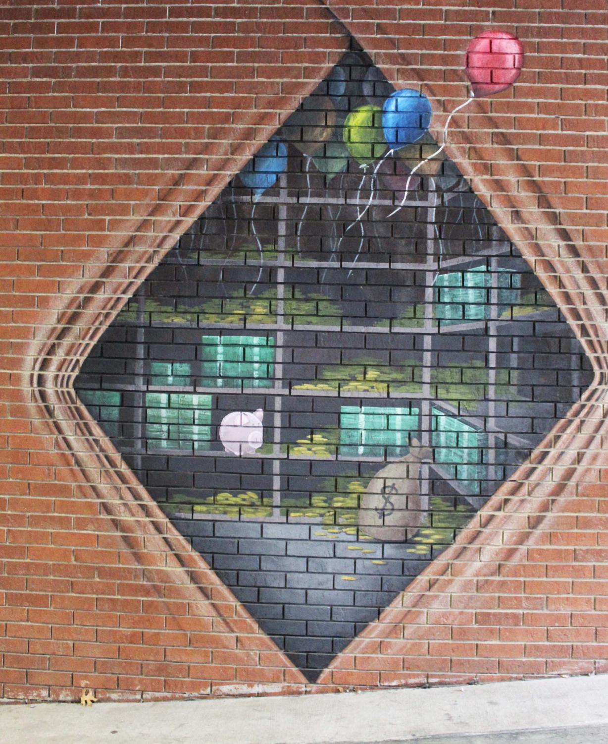 A bank vault with money hidden inside plastered on a brick wall in an alley.