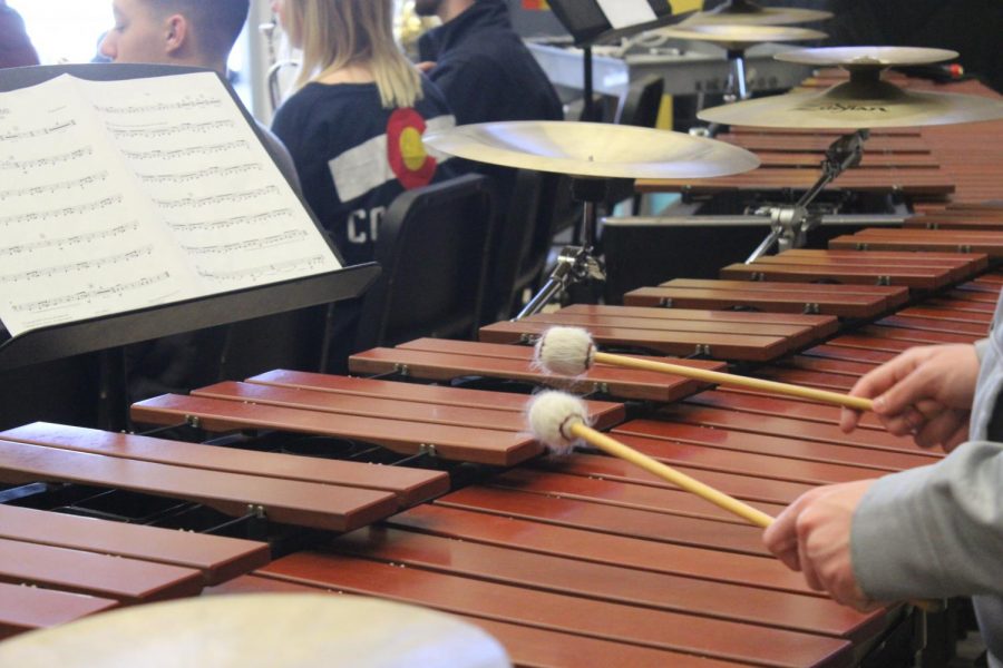 A student in band plays the Marimba. 