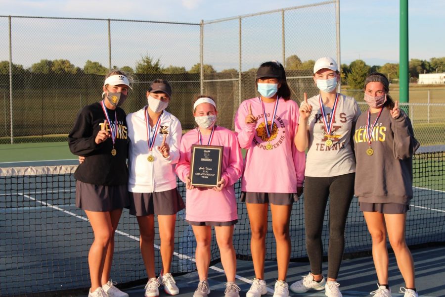 Kickapoo Girls Tennis hold the Ozark Conference Championship plaque.