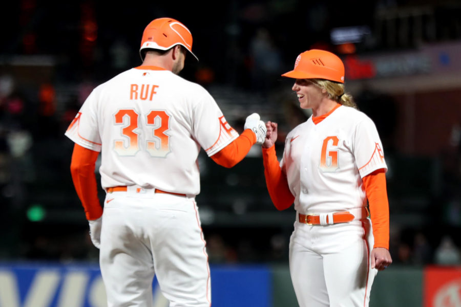 The+San+Francisco+Giants+Darin+Ruf+%2833%29+fist-+bumps+first+base+coach+Alyssa+Nakken+after+reaching+base+on+a+fourth-inning+walk+at+Oracle+Park+on+April+12%2C+2022%2C+in+San+Francisco.+Photo+courtesy+of+MCT+direct%2C+Ray+Chavez%2FBay+Area+News+Group%2FTNS