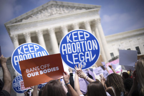 Abortion rights advocates and anti-abortion activists demonstrate in front of the Supreme Court. Photo Courtesy Win McNamee/Getty Images/TNS