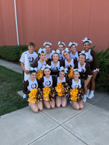The cheer team poses for a picture at their competition.