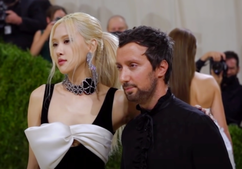 Performer Rosé poses on the carpet at the 2021 Met Gala with Saint Laurent designer, Anthony Vaccarello with the theme being “In America: A Lexicon of Fashion.” Photo Courtesy to Wikimedia Commons. 