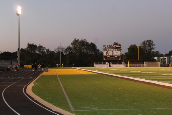 Students and community members walking around the track to step up for Down Syndrome.