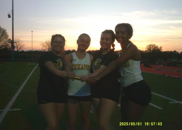 Girls celebrate at their Republic-Relays Meet Throwers Relay.