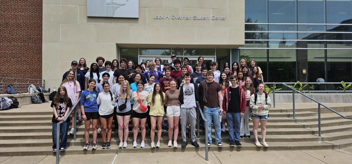 Students standing outside of Pittsburg State University on Science Day. 