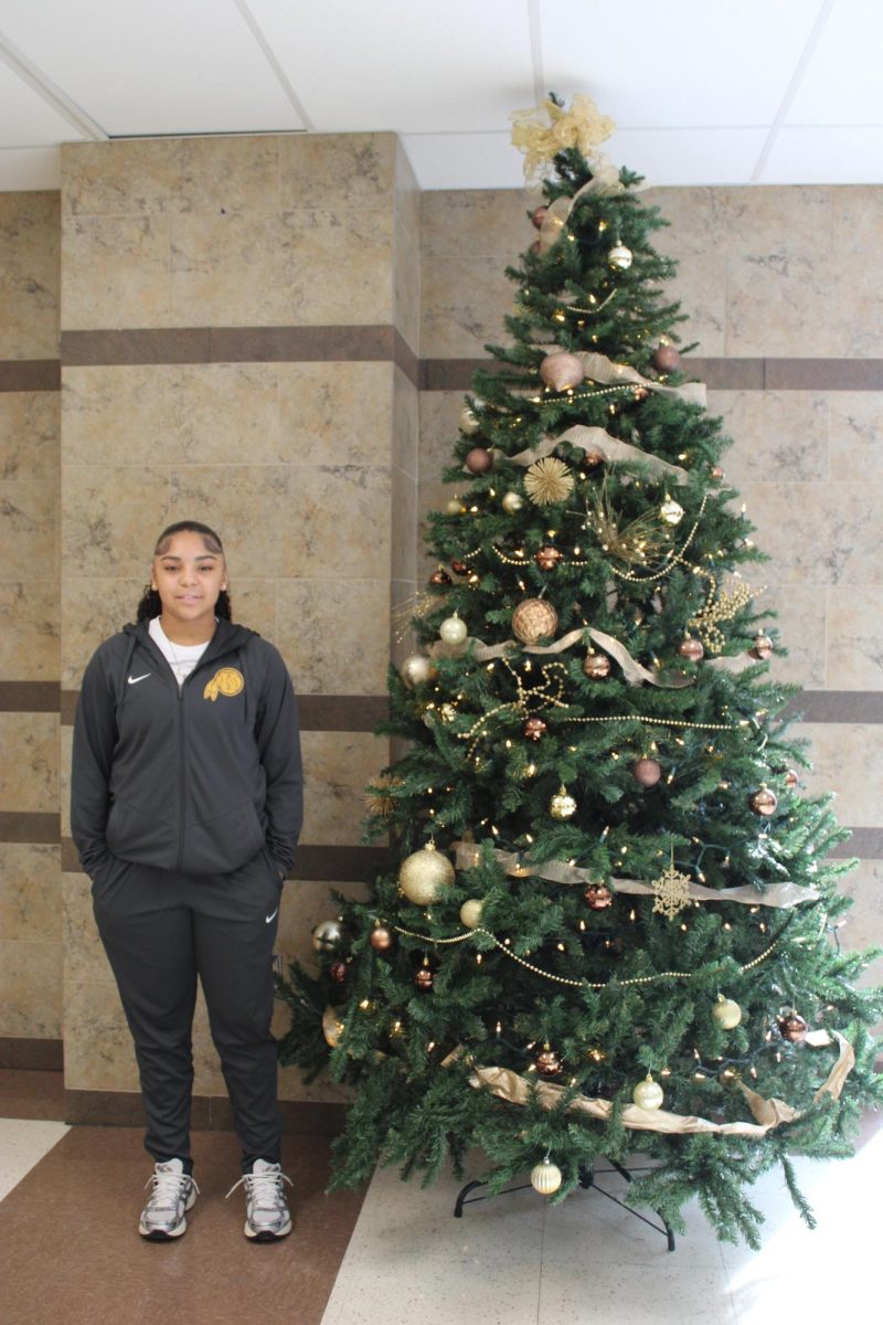 Sophomore Niell Ross showing school spirit in her warm-ups, preparing for a game. 
